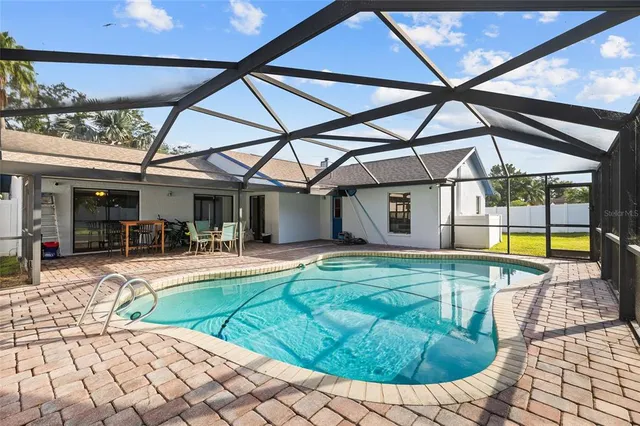 a view of a swimming pool with a patio