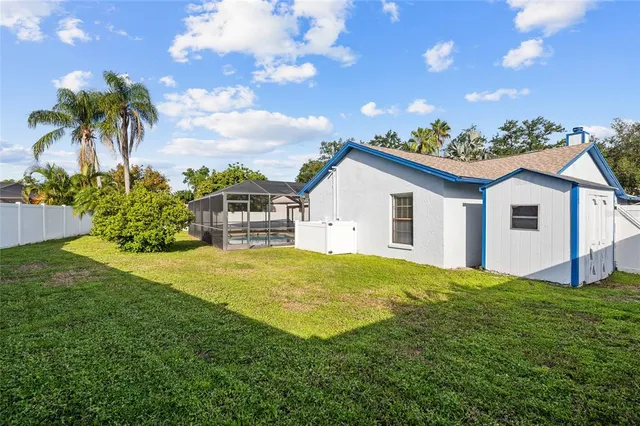 a view of a backyard with plants and a garden