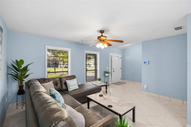 a living room with furniture and a table