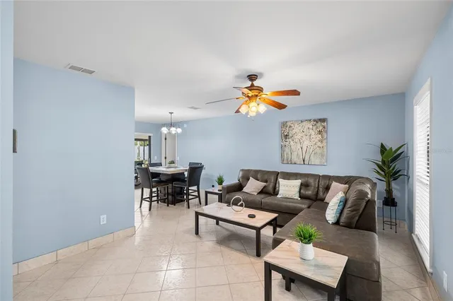 a view of a dining room with a table and chairs
