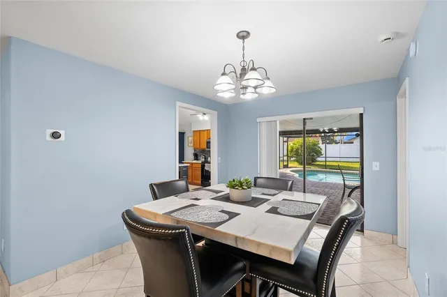 a kitchen with stainless steel appliances granite countertop a sink and a refrigerator
