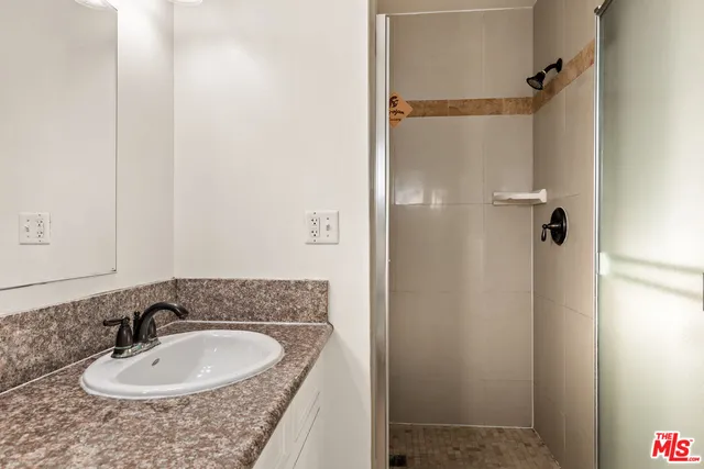 a view of a livingroom with wooden floor and window