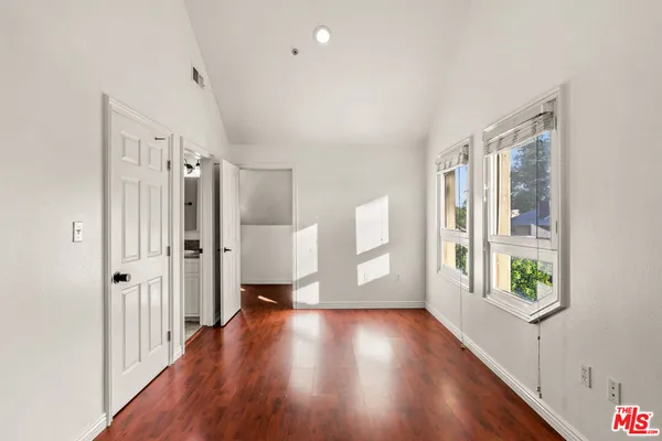 a view of entryway with wooden floor
