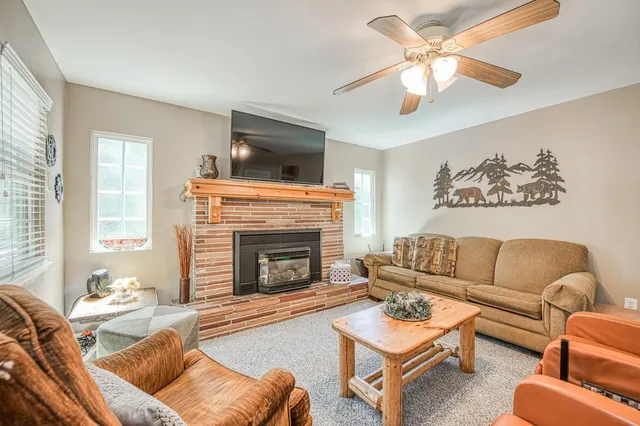 a living room with furniture and a fireplace