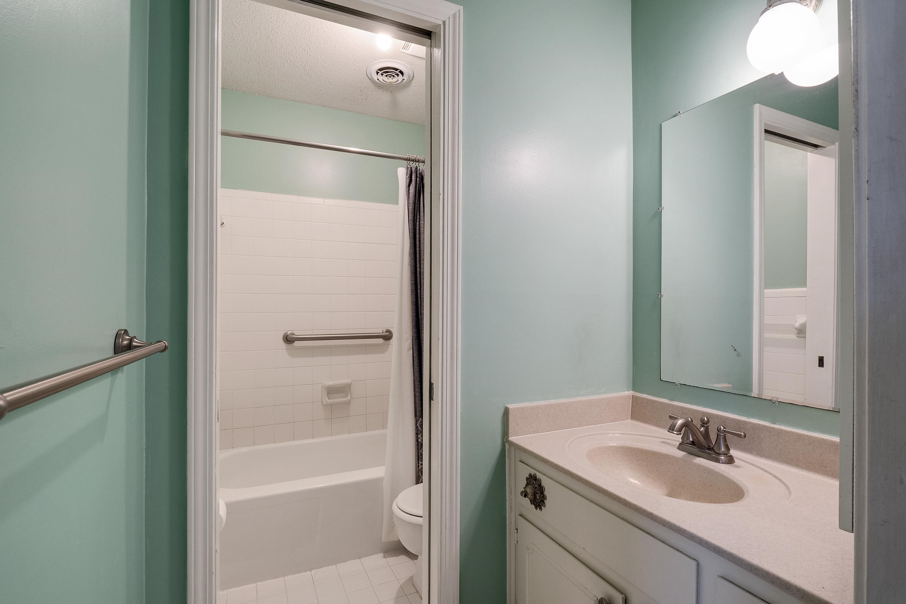 5849 Ridgevale Road Memphis, TN 38119 - Photo 12 of 22 a bathroom with a granite countertop sink toilet and shower