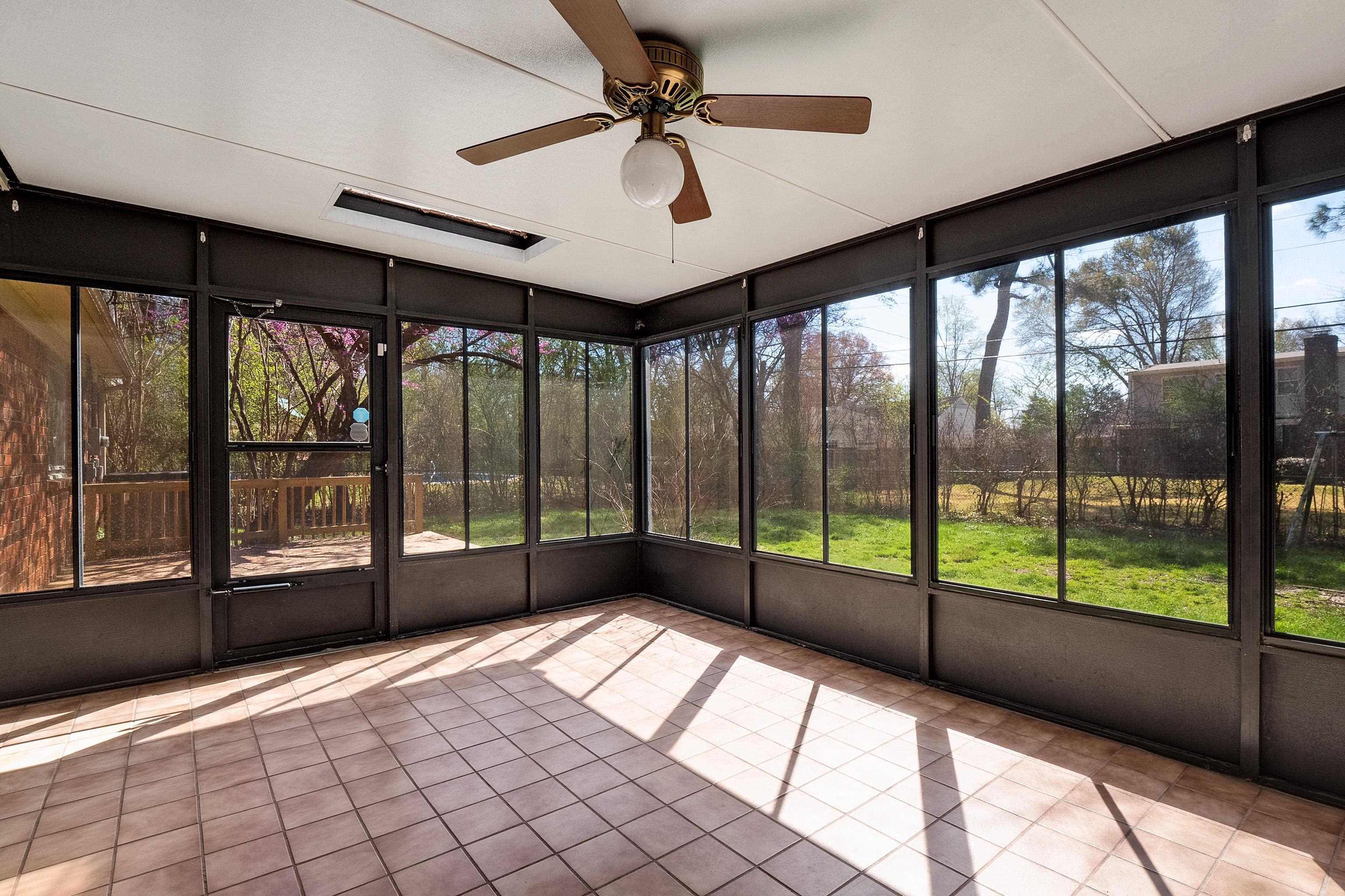 5849 Ridgevale Road Memphis, TN 38119 - Photo 18 of 22 a view of an empty room with windows