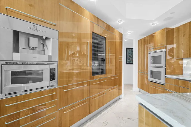 a view of a kitchen with a sink and cabinets
