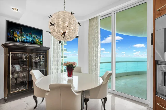 a view of a two chairs in the patio