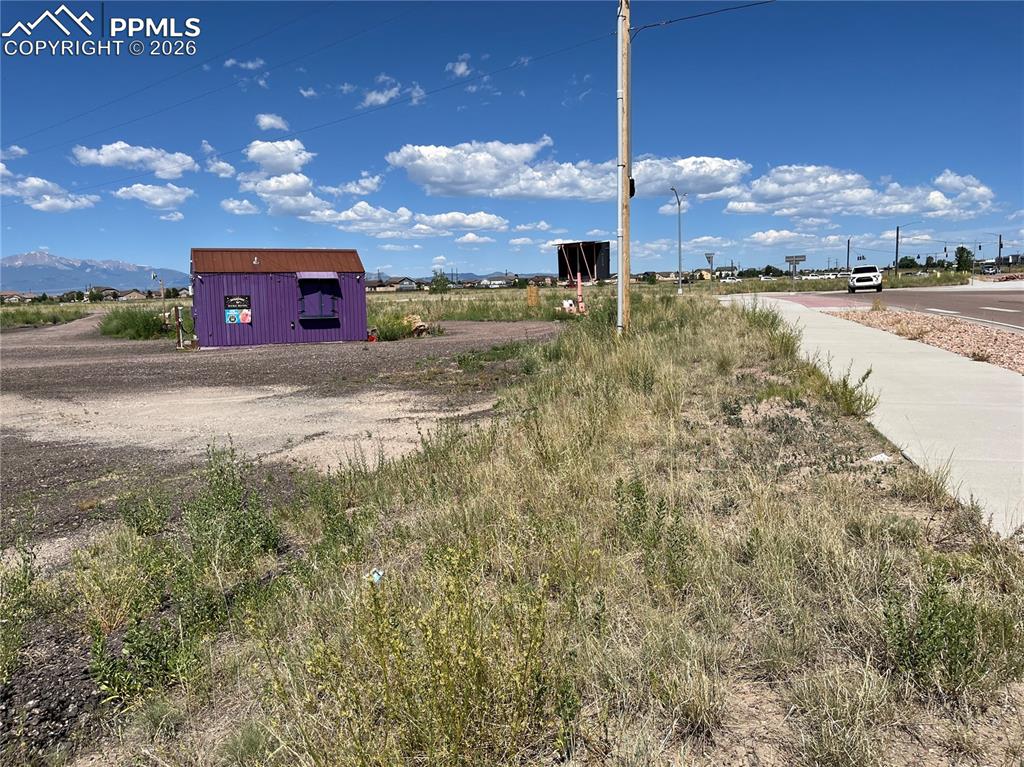 7110 Old Meridian Road Peyton, CO 80831 - Photo 10 of 20 a view of a yard in front of the house