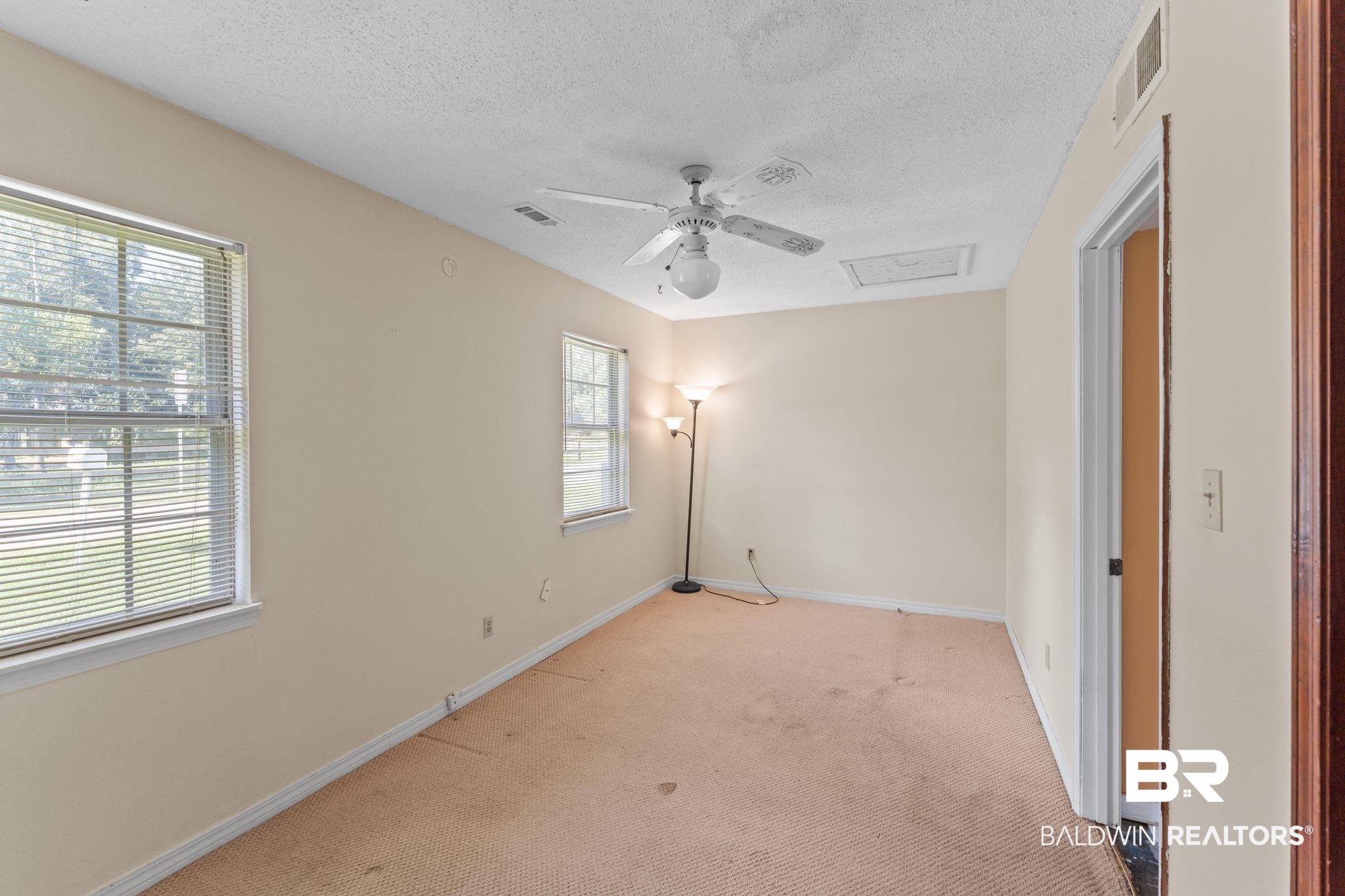 14095 Riverside Drive Foley, AL 36535 - Photo 18 of 30 Empty room with a textured ceiling, light colored carpet, and ceiling fan