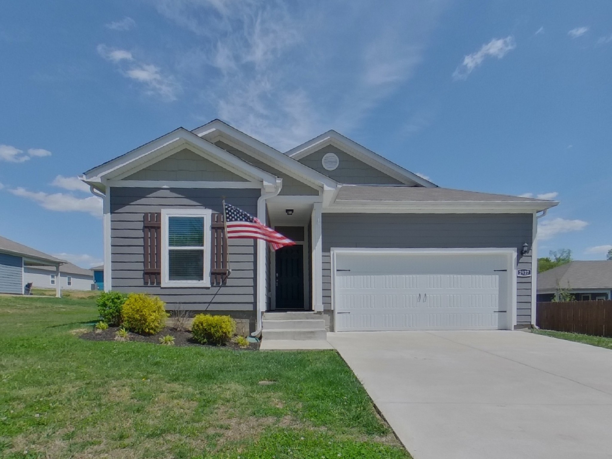2927 Beeswax Street Columbia, TN 38401 - Photo 1 of 14 a front view of a house with a yard and garage
