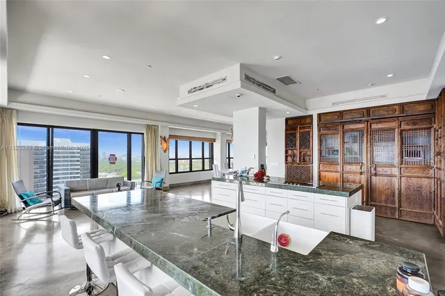 a lobby with furniture and floor to ceiling window