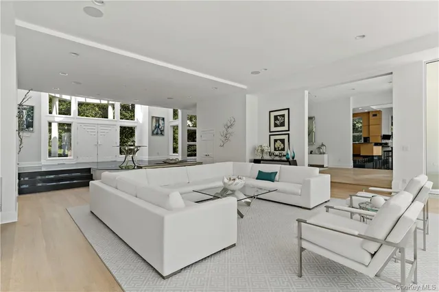 a living room with furniture and flat screen tv