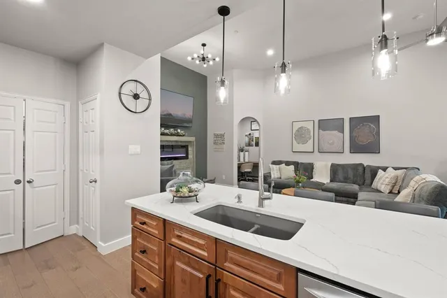 a living room with furniture and a mirror