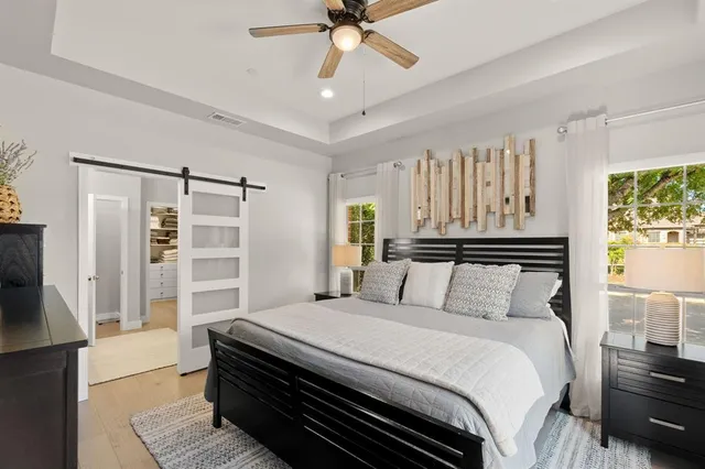 a bedroom with a bed and a walk in closet