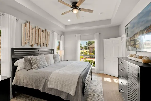 a bedroom with a bed and a chandelier