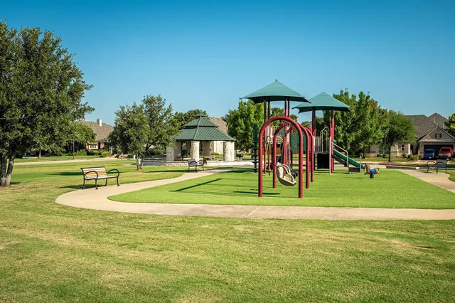 a view of a playground with basketball court