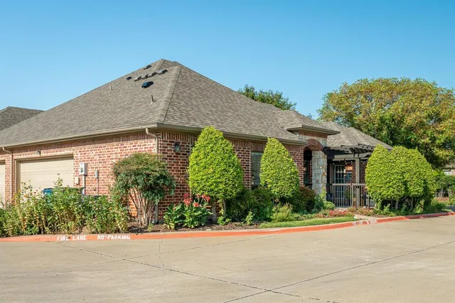 front view of a house with potted plants