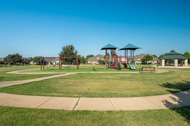 a view of a house with a yard porch and sitting area