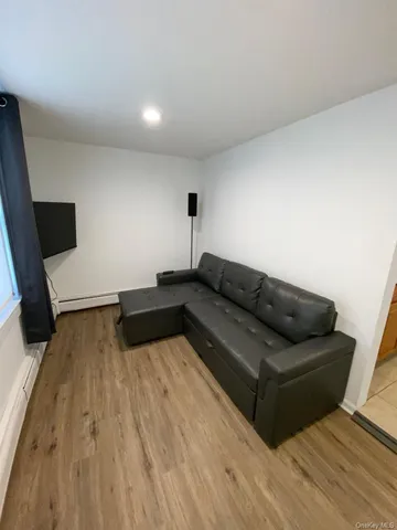 a living room with a couch and a flat screen tv