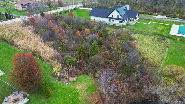 a backyard of a house with lots of green space
