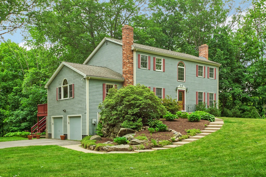 207 Beaman Road Princeton, MA 01541 - Photo 1 of 30 a front view of a house with a yard and porch