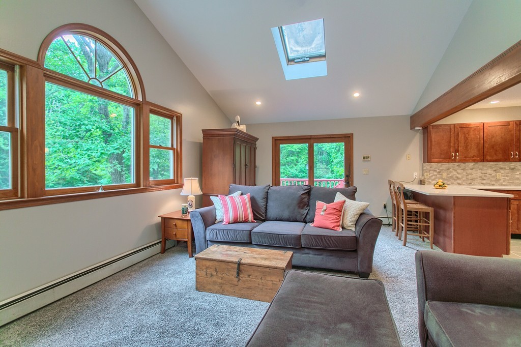 207 Beaman Road Princeton, MA 01541 - Photo 11 of 30 a living room with furniture and a fireplace