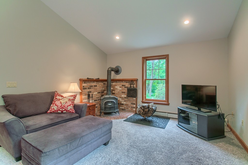 207 Beaman Road Princeton, MA 01541 - Photo 12 of 30 a living room with furniture and a flat screen tv