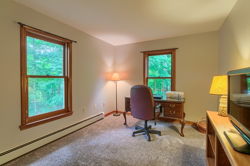 207 Beaman Road Princeton, MA 01541 - Photo 15 of 30 a view of a workspace with furniture and a window
