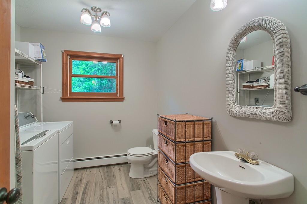 207 Beaman Road Princeton, MA 01541 - Photo 17 of 30 a bathroom with a toilet a sink and mirror
