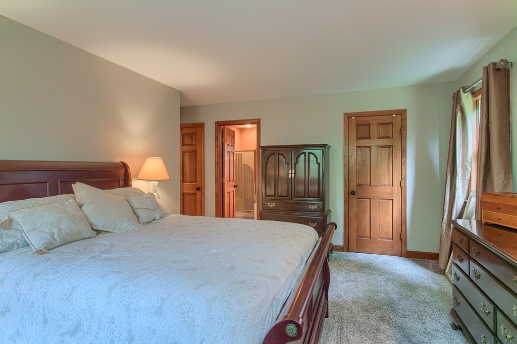 207 Beaman Road Princeton, MA 01541 - Photo 23 of 30 a bedroom with a bed and a refrigerator