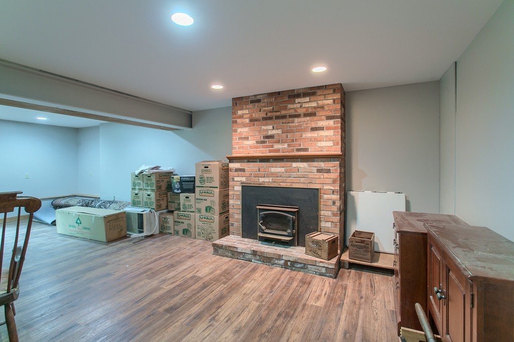 207 Beaman Road Princeton, MA 01541 - Photo 26 of 30 a living room with furniture and a fireplace