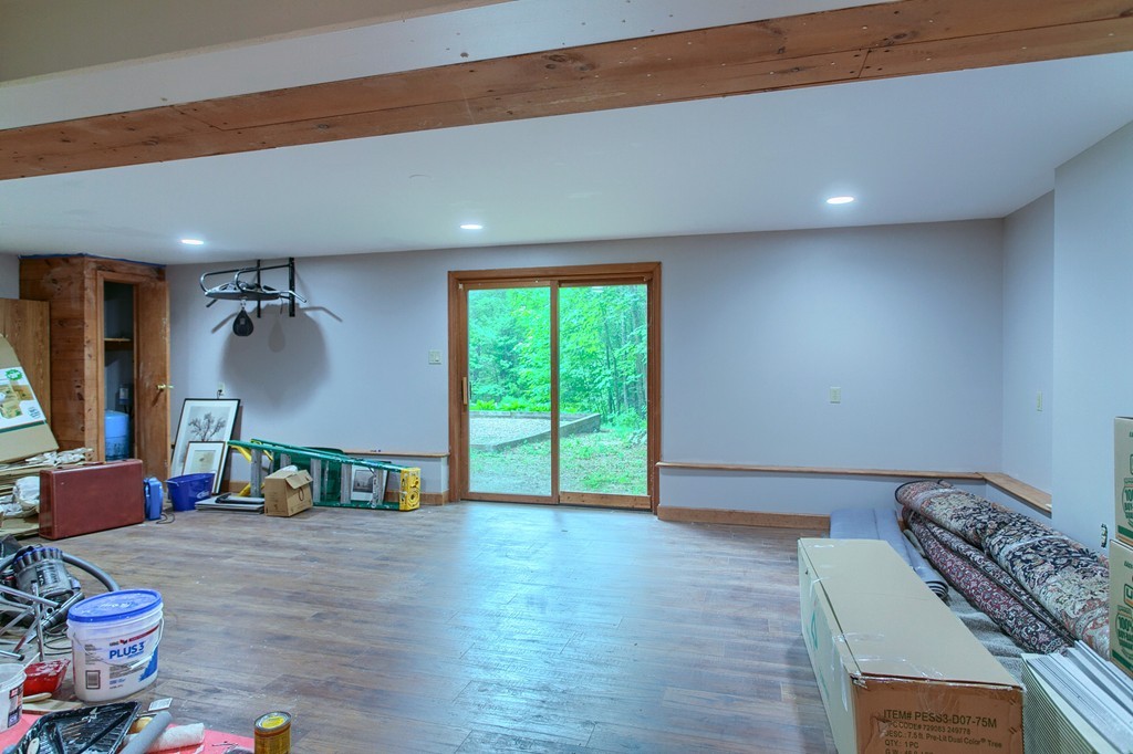 207 Beaman Road Princeton, MA 01541 - Photo 27 of 30 a living room with furniture and a wooden floor