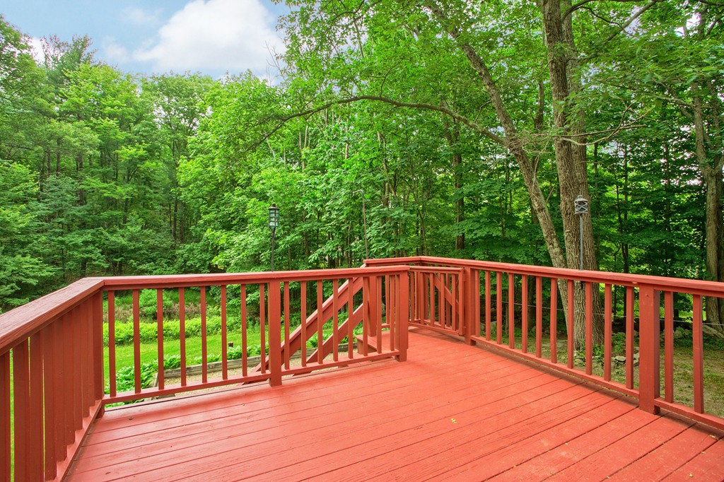 207 Beaman Road Princeton, MA 01541 - Photo 30 of 30 a balcony with wooden floor