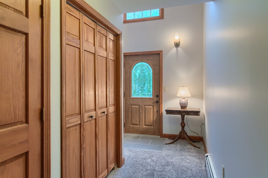 207 Beaman Road Princeton, MA 01541 - Photo 6 of 30 a view of a bedroom with a bed and a table