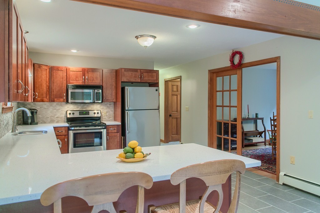207 Beaman Road Princeton, MA 01541 - Photo 9 of 30 a dinning room with stainless steel appliances granite countertop a dining table and chairs