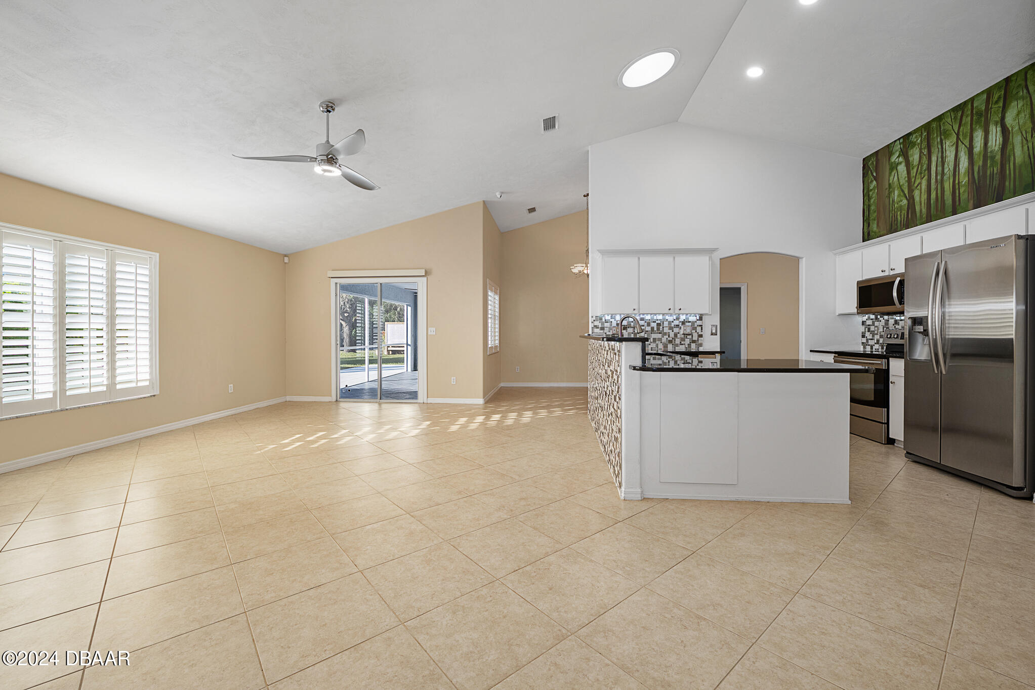 63 Spring Meadows Drive Ormond Beach, FL 32174 - Photo 15 of 49 a view of kitchen with cabinets and refrigerator