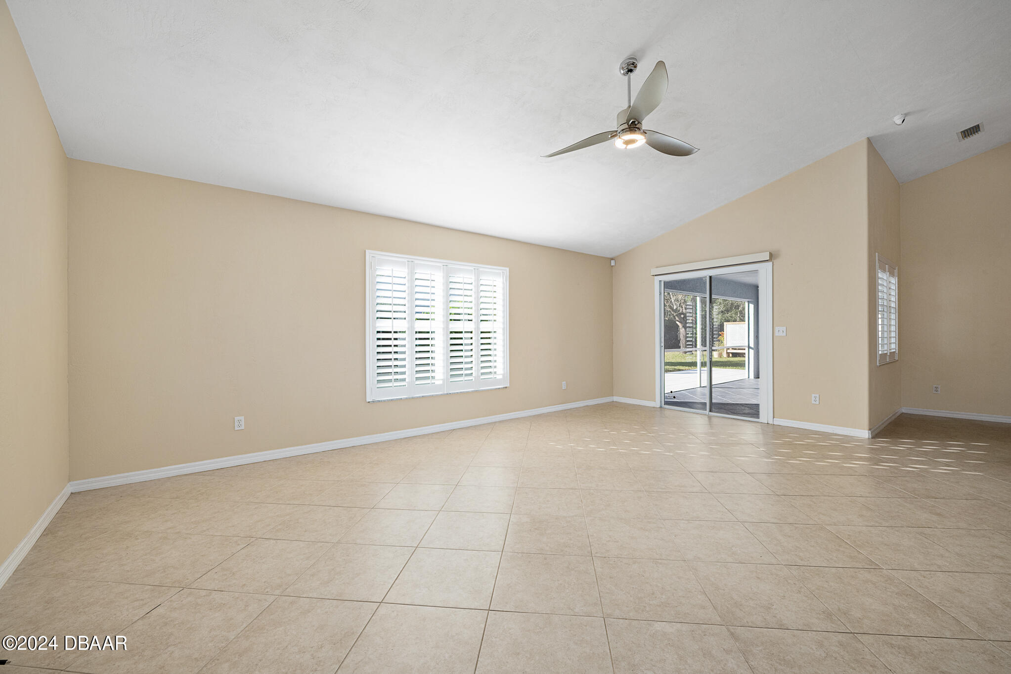 63 Spring Meadows Drive Ormond Beach, FL 32174 - Photo 16 of 49 a view of an empty room with a window