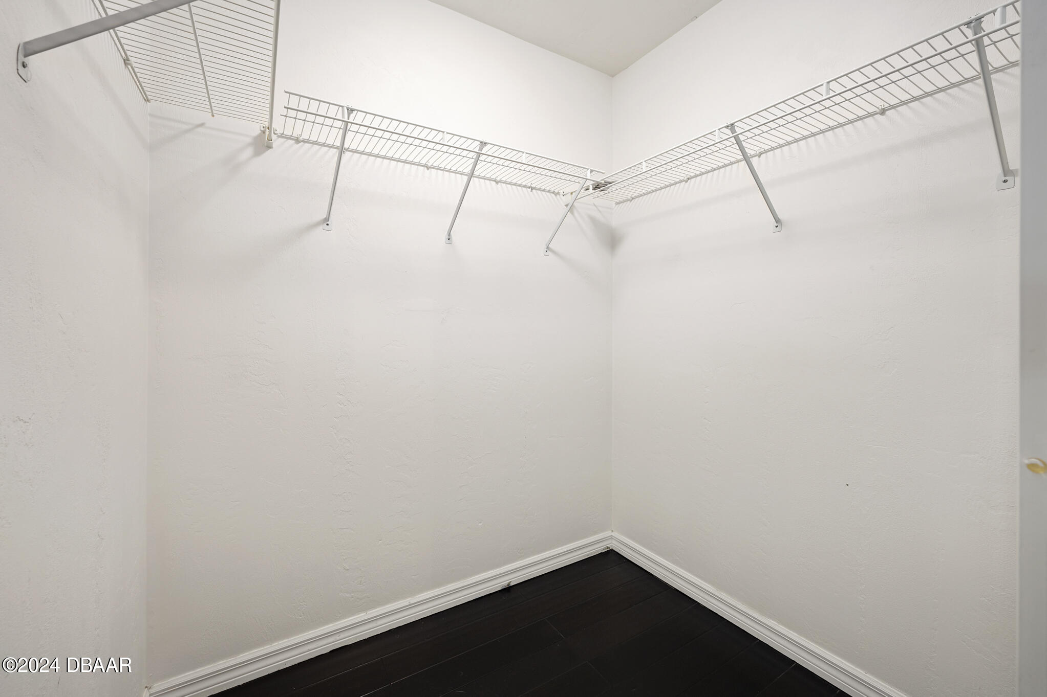 63 Spring Meadows Drive Ormond Beach, FL 32174 - Photo 22 of 49 a view of a room with racks on the wall