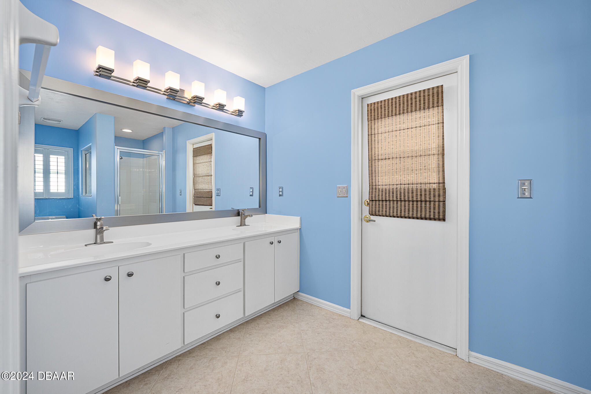 63 Spring Meadows Drive Ormond Beach, FL 32174 - Photo 23 of 49 a spacious bathroom with a double vanity sink and a mirror