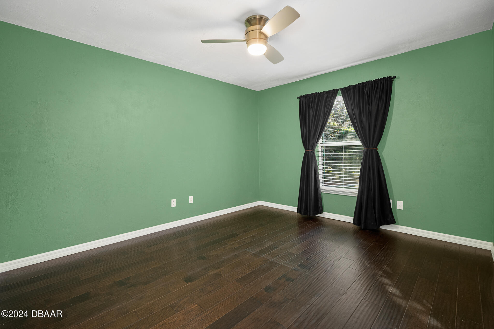63 Spring Meadows Drive Ormond Beach, FL 32174 - Photo 25 of 49 a view of empty room with wooden floor and fan