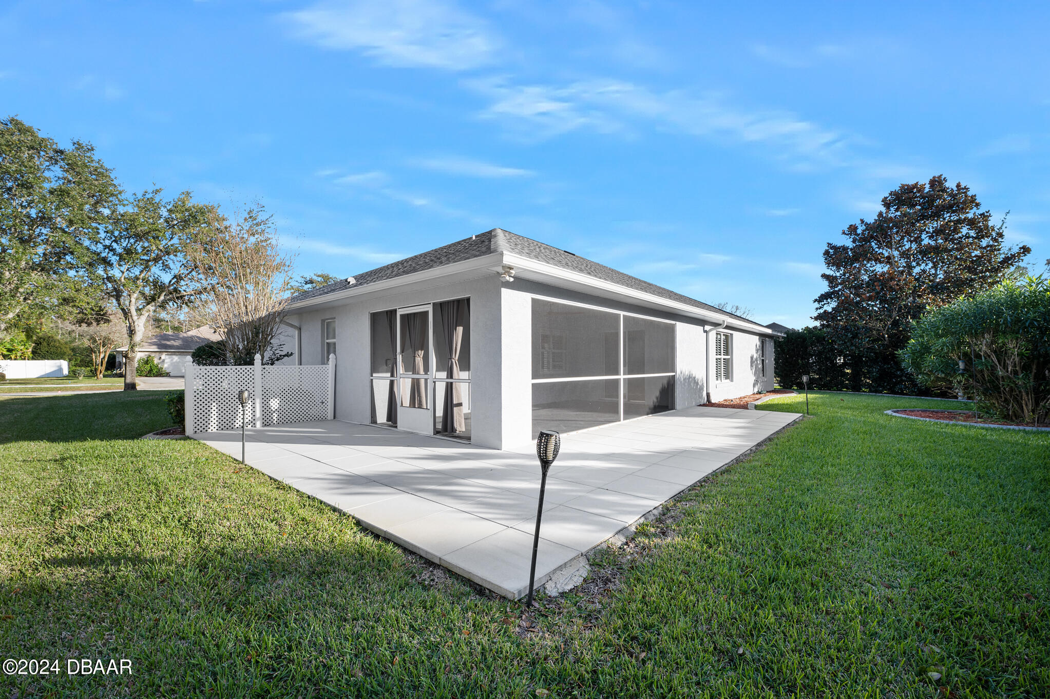 63 Spring Meadows Drive Ormond Beach, FL 32174 - Photo 32 of 49 a front view of a house with a yard and garage