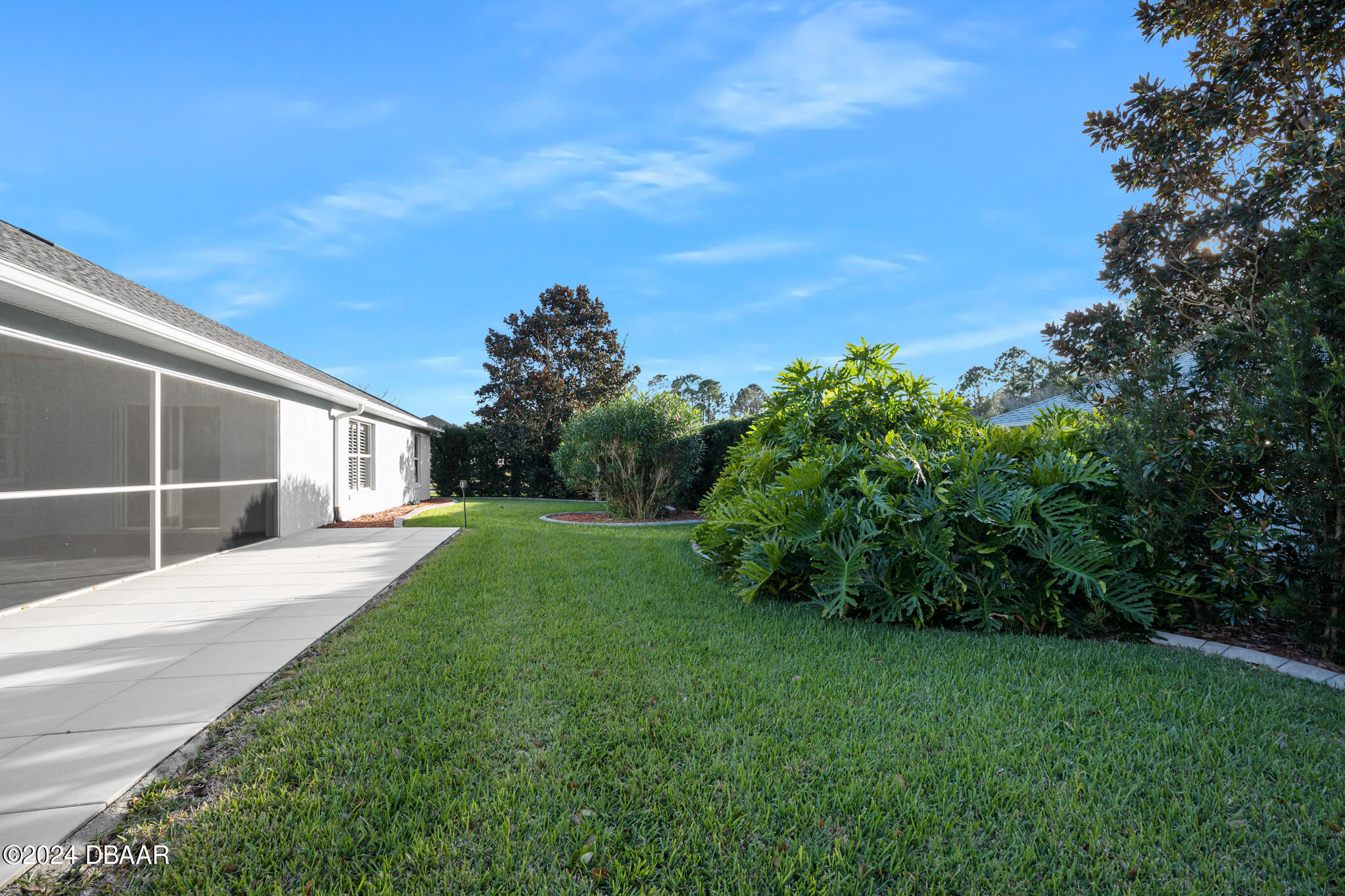 63 Spring Meadows Drive Ormond Beach, FL 32174 - Photo 33 of 49 a view of a house with backyard and garden
