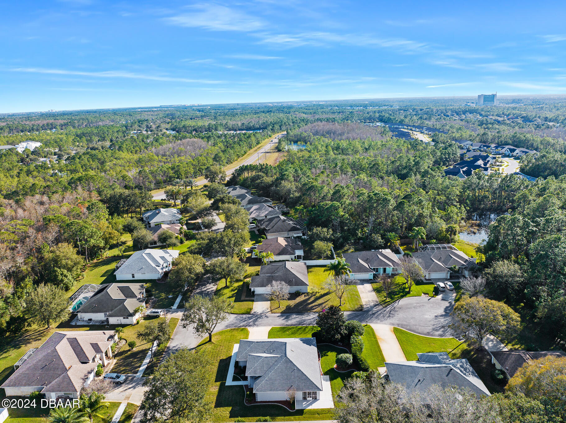 63 Spring Meadows Drive Ormond Beach, FL 32174 - Photo 39 of 49 an aerial view of residential houses with outdoor space and swimming pool