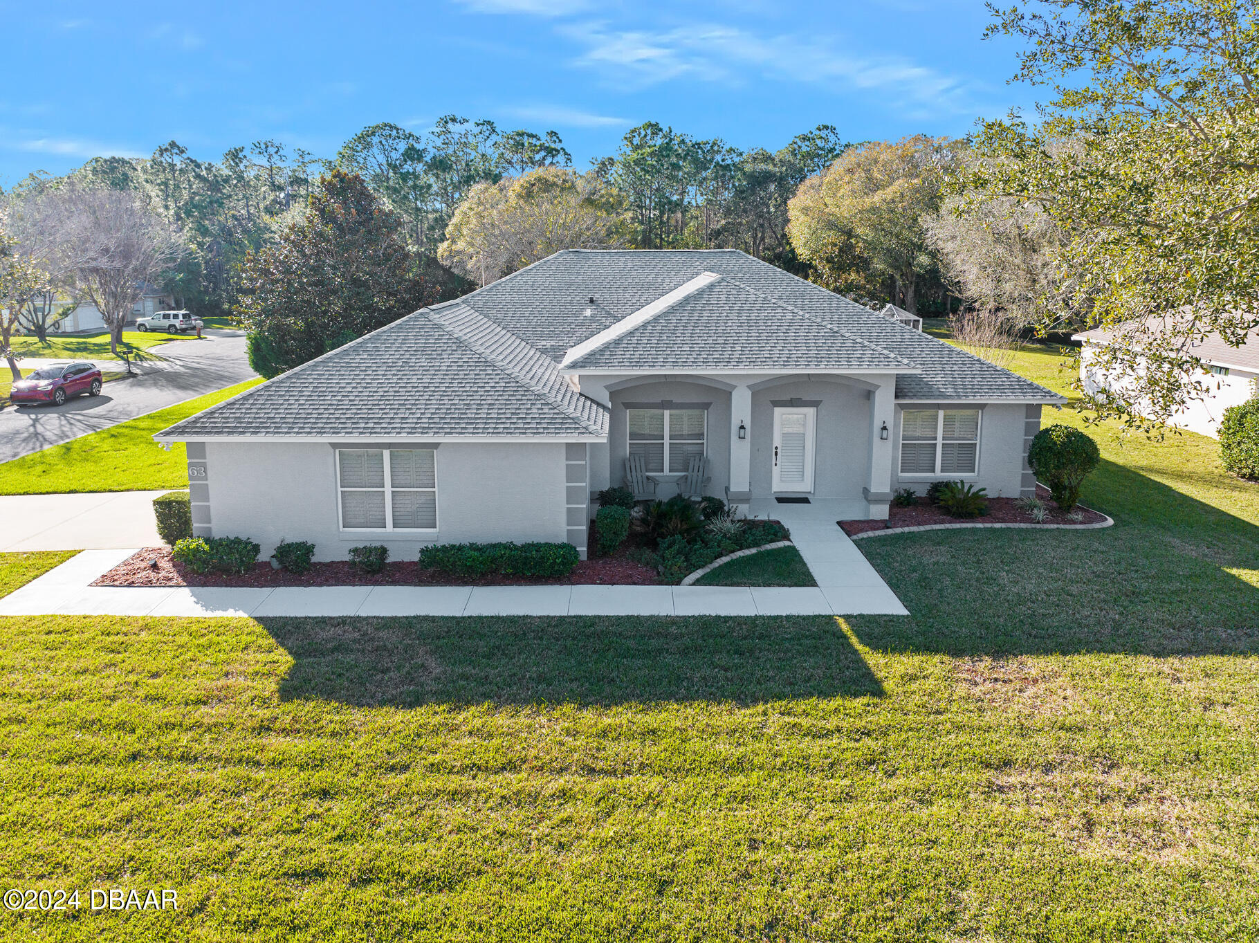 63 Spring Meadows Drive Ormond Beach, FL 32174 - Photo 43 of 49 a view of a house with a yard