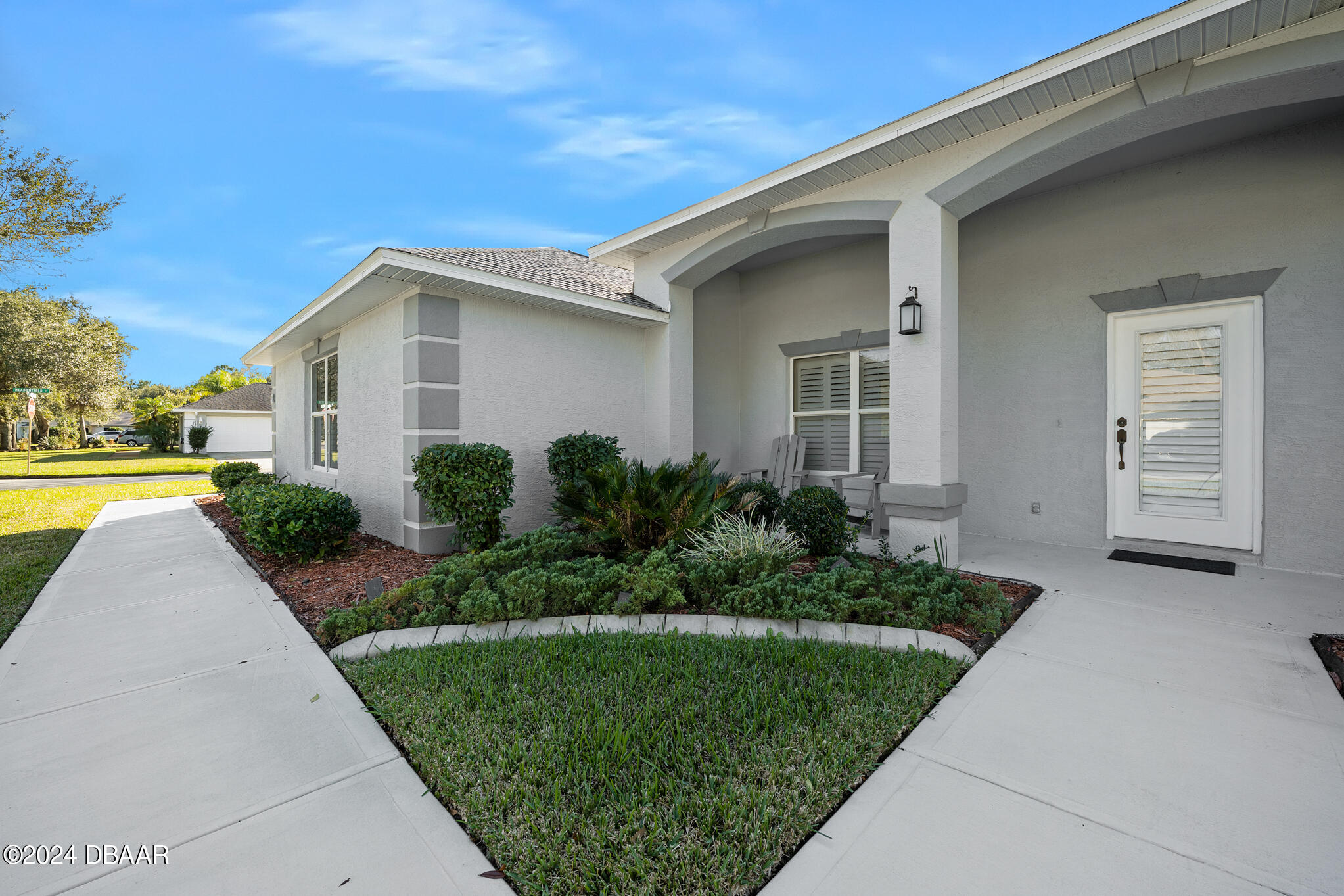 63 Spring Meadows Drive Ormond Beach, FL 32174 - Photo 5 of 49 a front view of a house with a yard