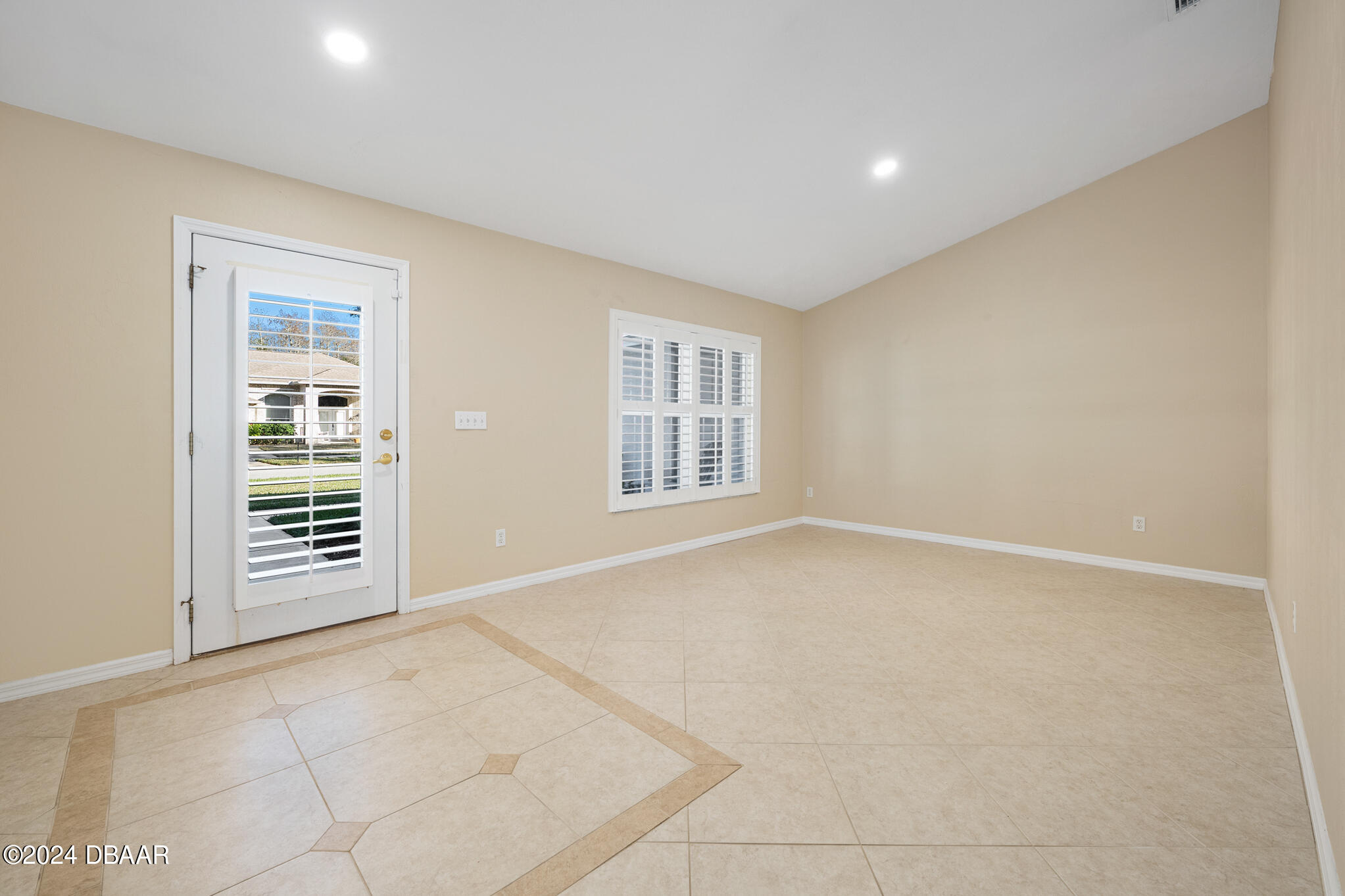 63 Spring Meadows Drive Ormond Beach, FL 32174 - Photo 6 of 49 a view of an empty room with a window