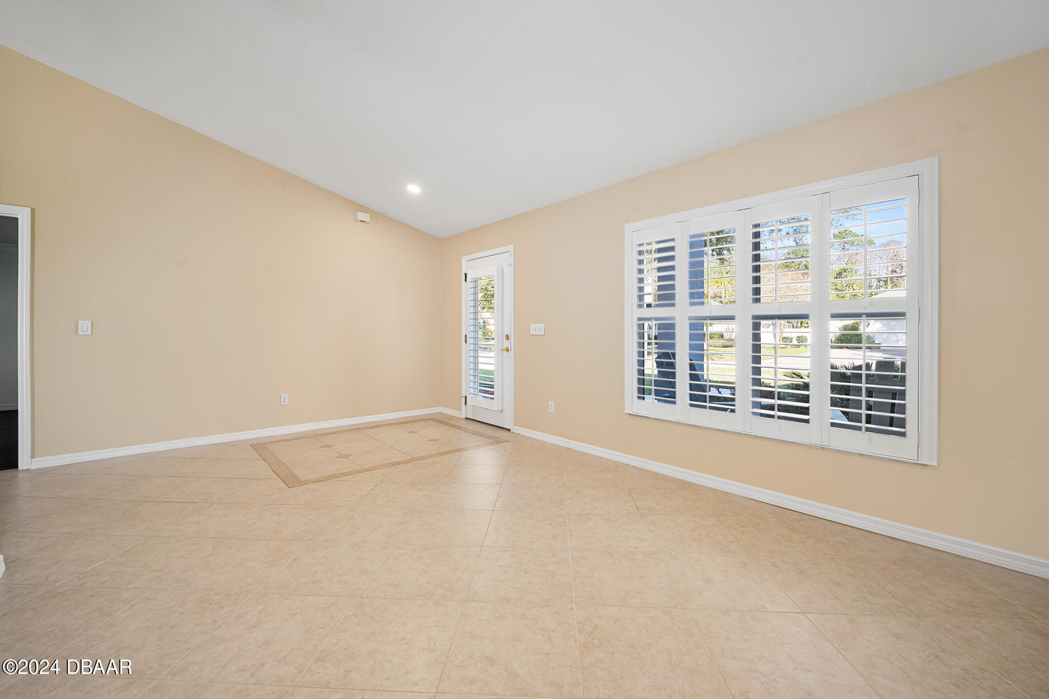 63 Spring Meadows Drive Ormond Beach, FL 32174 - Photo 7 of 49 an empty room with windows