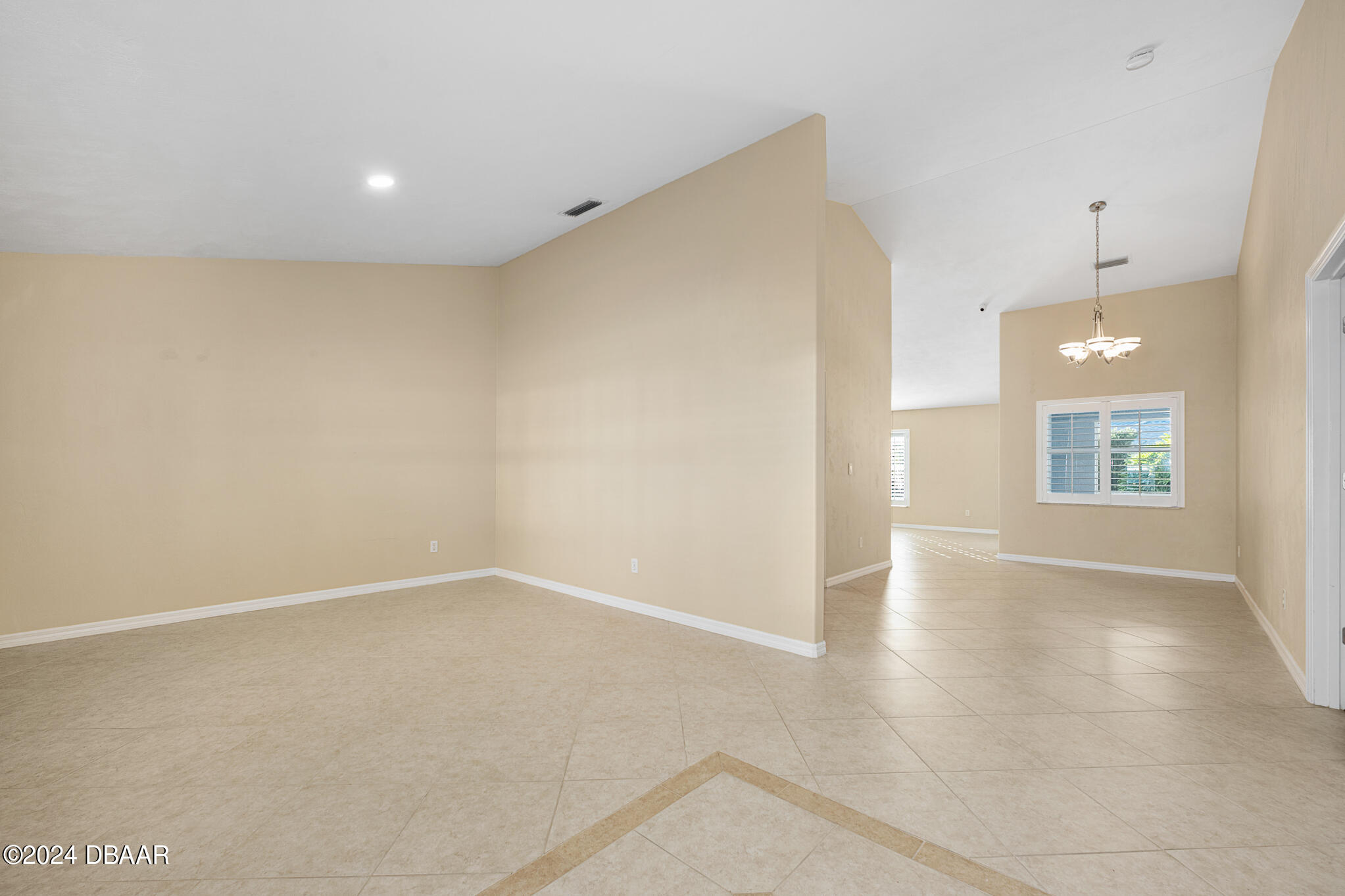 63 Spring Meadows Drive Ormond Beach, FL 32174 - Photo 8 of 49 an empty room with windows and entrance