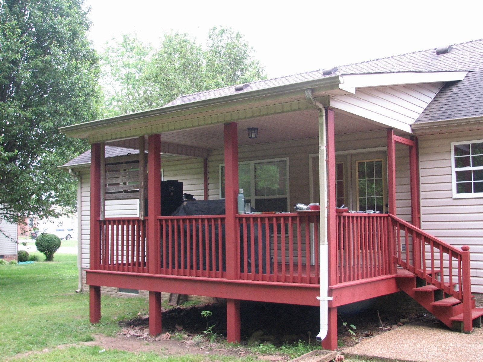 133 Cora Street Portland, TN 37148 - Photo 22 of 29 a view of a wooden house with a small yard and wooden fence